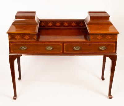 Appraisal: An Edwardian mahogany table with drawers to the two sides