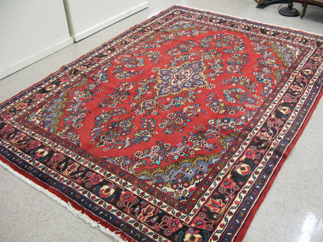 Appraisal: PERSIAN HAMADAN CARPET central medallion and floral sprig decoration on