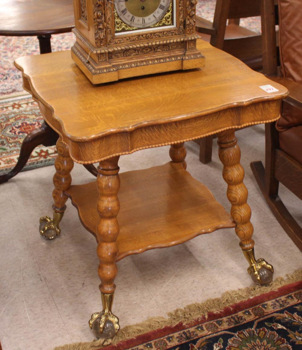 Appraisal: LATE VICTORIAN OAK LAMP TABLE American c square two-tier design