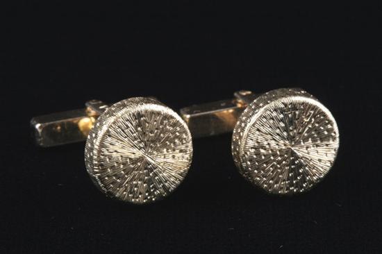 Appraisal: PAIR K YELLOW GOLD CUFFLINKS Hammered and grooved design The