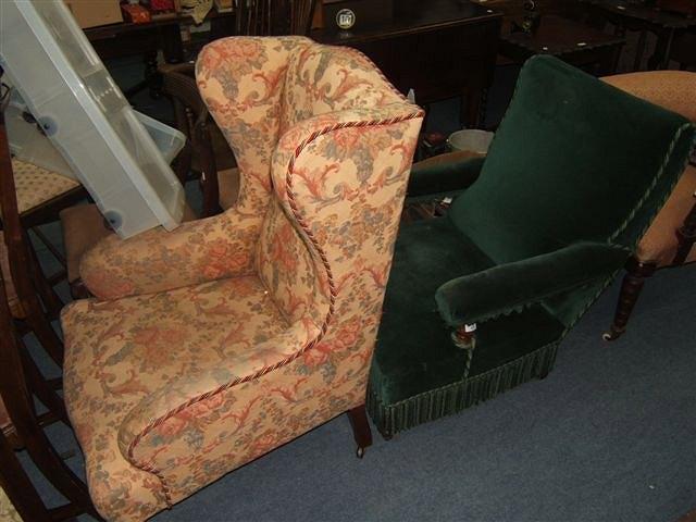 Appraisal: A Victorian green velvet upholstered armchair with turned front legs