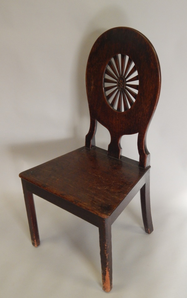 Appraisal: A George III mahogany hall chair the oval back with