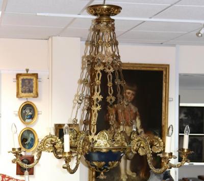 Appraisal: An early th Century gilt-metal six-branch chandelier hung from elaborate