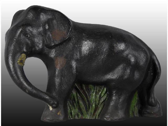 Appraisal: Elephant in Grass Cast Iron Doorstop Description Full-figure Made by