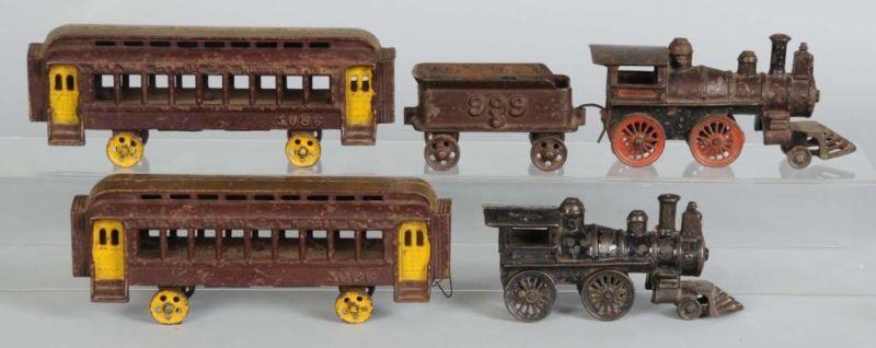 Appraisal: Cast Iron -Piece Train Set Description Includes steam engine tender