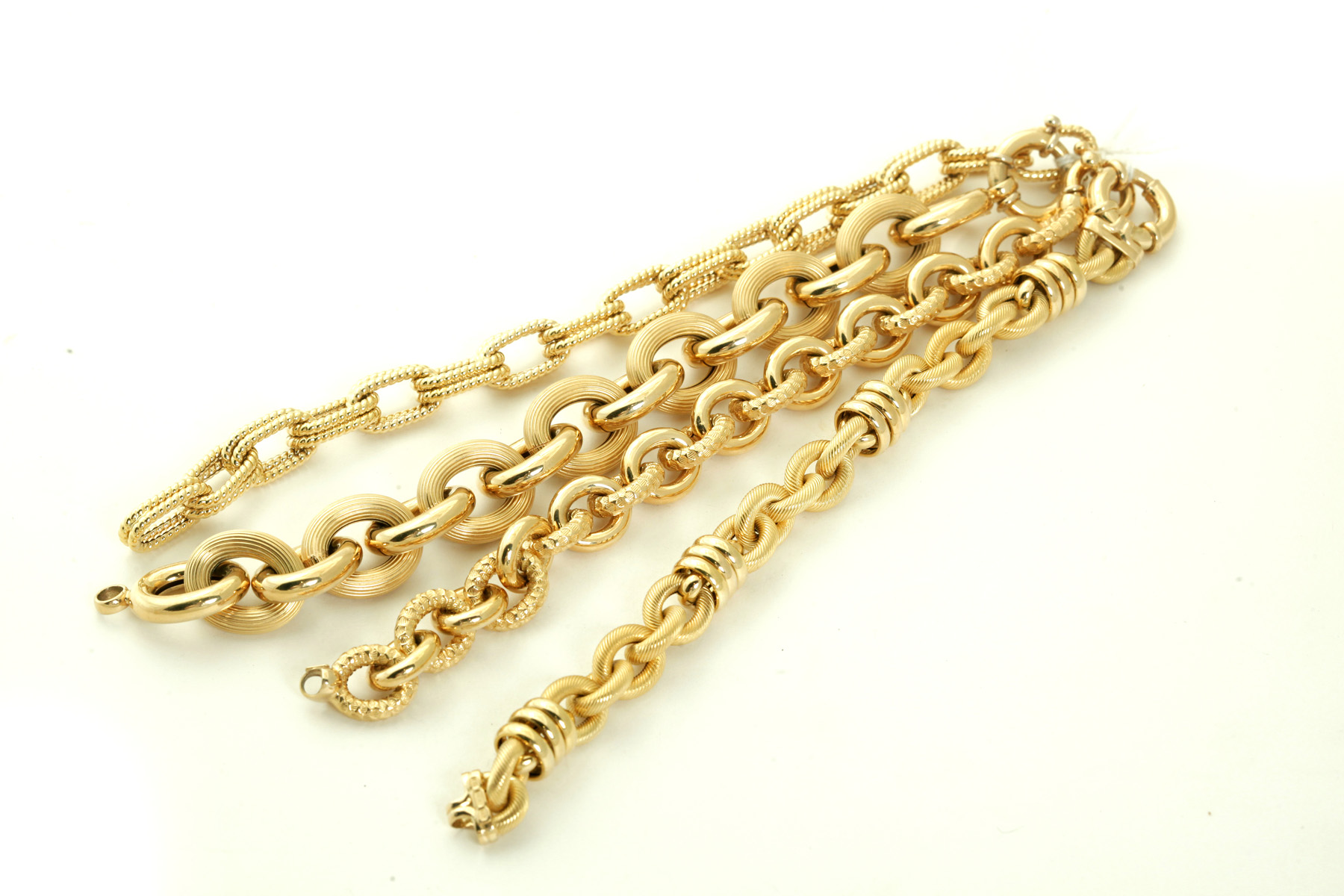 Appraisal: FOUR ITALIAN GOLD LINK BRACELETS Twentieth century k yellow gold