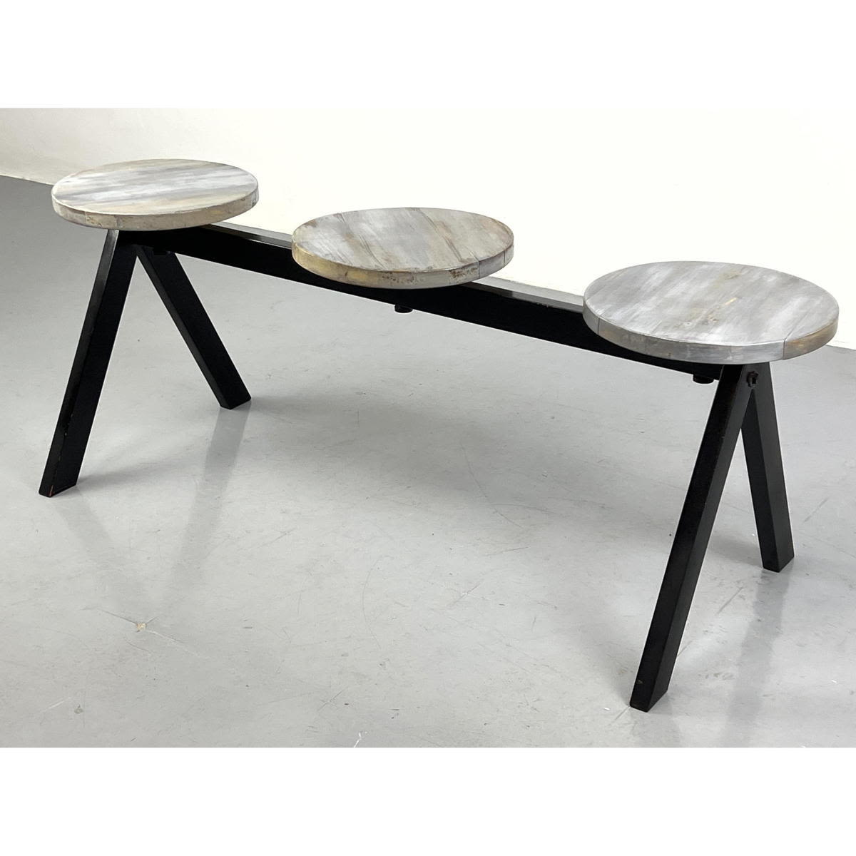 Appraisal: Contemporary Seat Bench Wood circle tops on steel base Dimensions