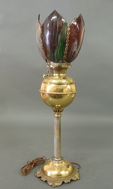 Appraisal: - Bradley Hubbard brass oil lamp with a slag glass