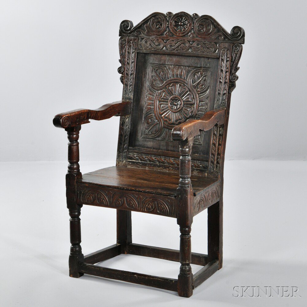 Appraisal: Oak Wainscot Armchair England th century panel back with carved