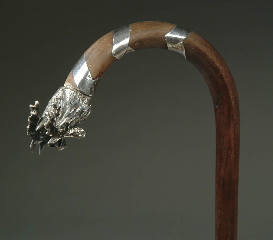 Appraisal: SILVER OVERLAY AND SILVER DOUBLE ROOSTER HEAD CROOK CANE Tapered