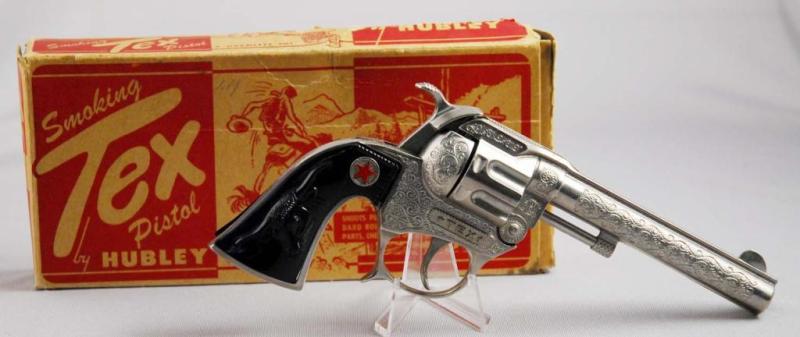 Appraisal: Hubley Smoking Tex Cap Pistol Toy Description Marked Tex on