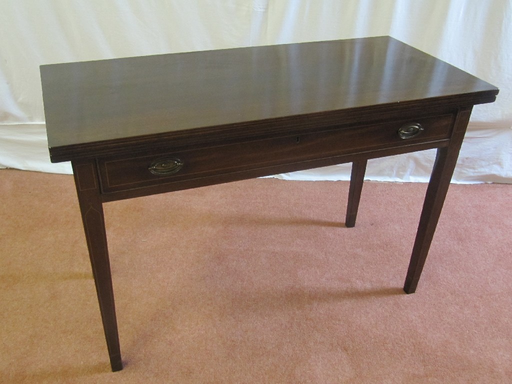 Appraisal: A Victorian mahogany turnover tea table raised over a single