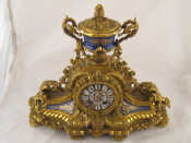 Appraisal: An impressive gilt bronze mantel clock with painted enamel dial