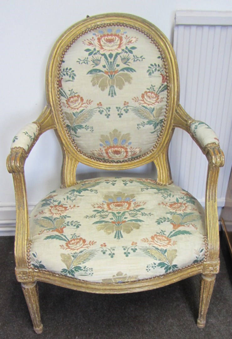 Appraisal: A pair of Louis XVI gilt framed fauteuils with semi