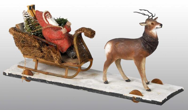 Appraisal: Santa in Sleigh with Reindeer Pull Toy Description Loofah sleigh