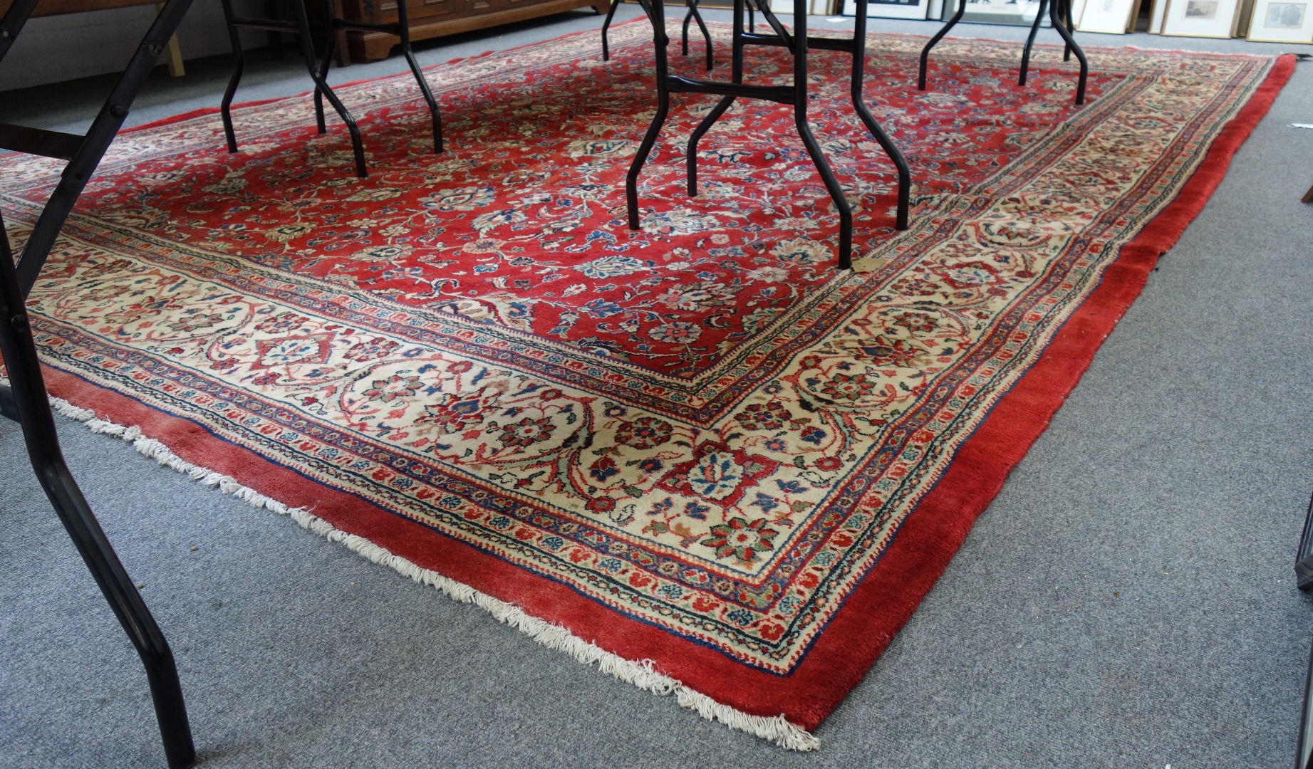 Appraisal: A Sarouk carpet Persian the madder field with an allover