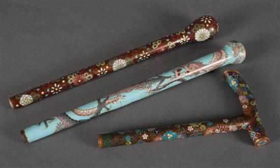 Appraisal: Two Japanese cloisonne umbrella handles and a similar cane handle