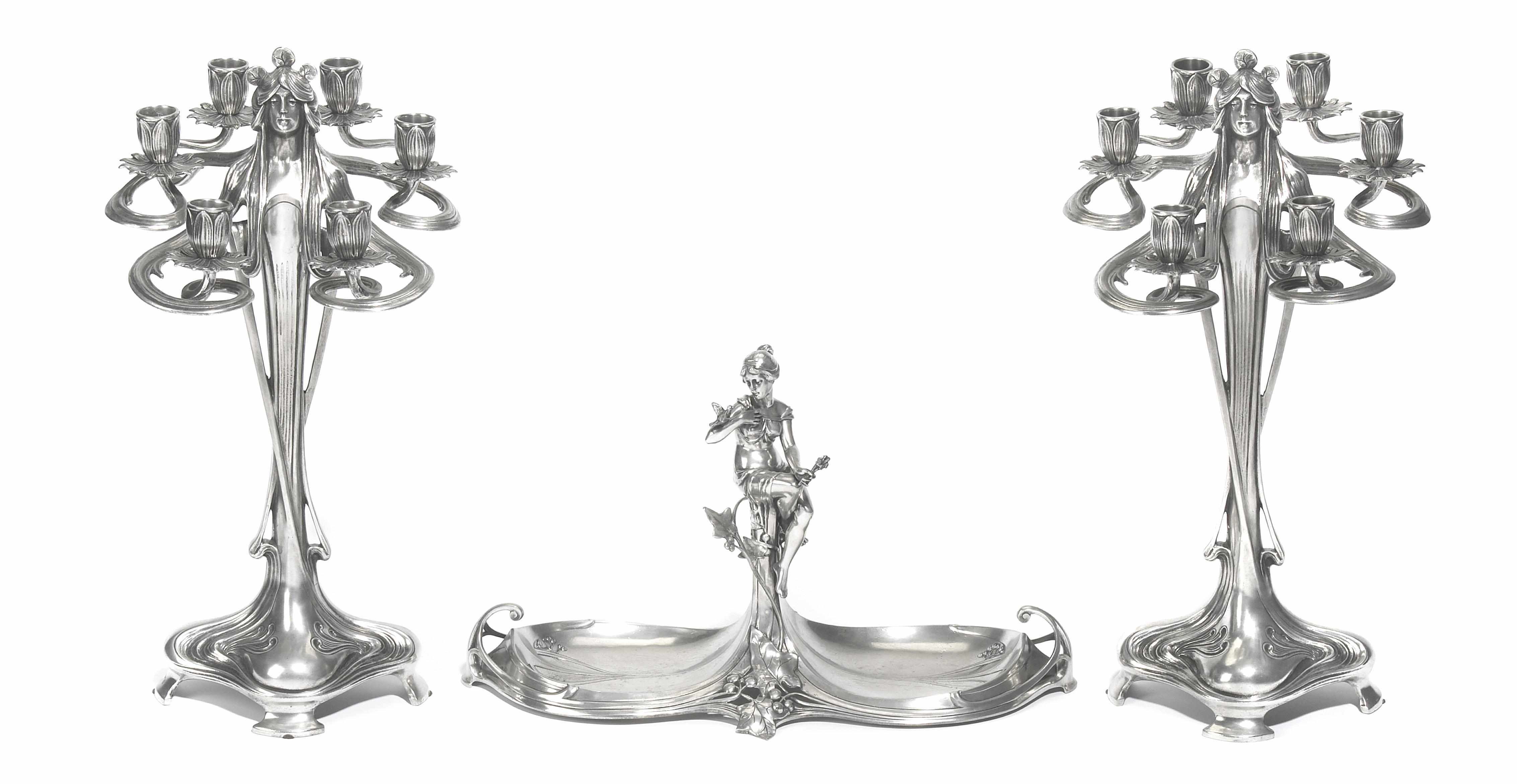 Appraisal: An Art Nouveau pewter assembled three-piece figural garniture comprising a