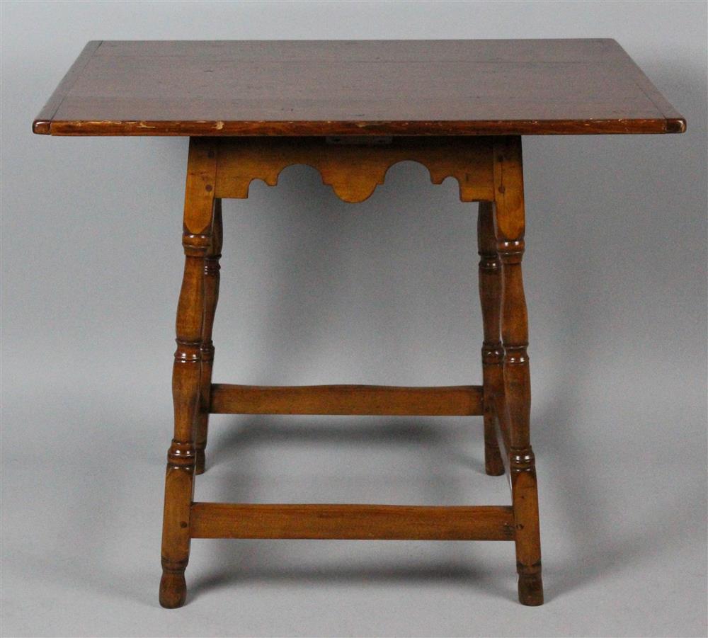 Appraisal: MIXED WOOD TAVERN TABLE having a large overhanging pine top