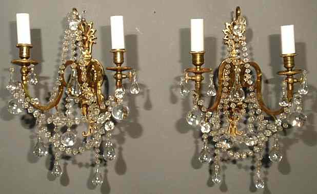 Appraisal: Pair of brass electric wall sconces each with two arms