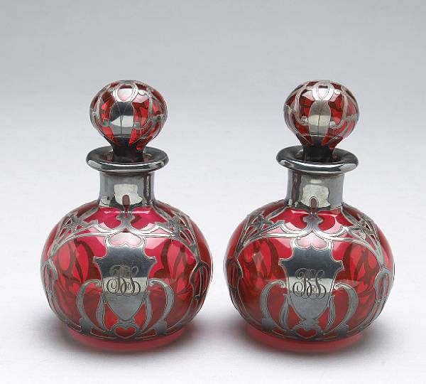 Appraisal: A pair of Art Nouveau Gorham silver overlay cranberry glass