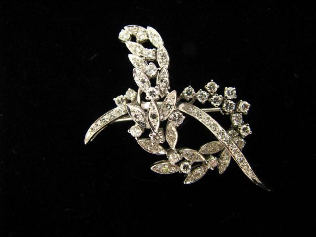 Appraisal: K white gold vine design pin accented with approximately fifty-five