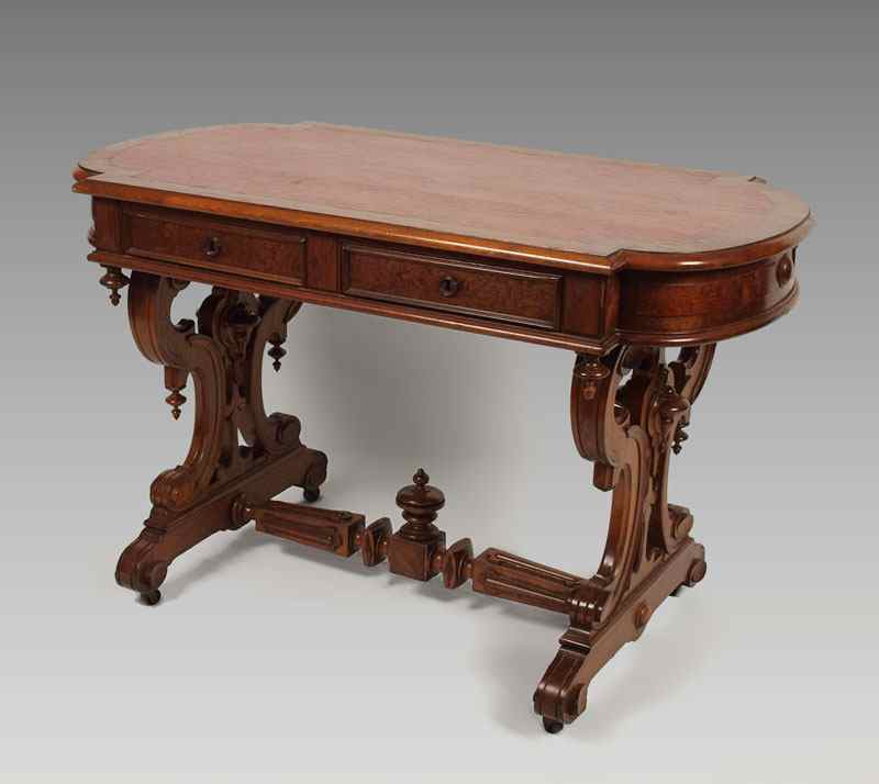 Appraisal: VICTORIAN WALNUT AND BURL RENAISSANCE STYLE TABLE Red leather inset