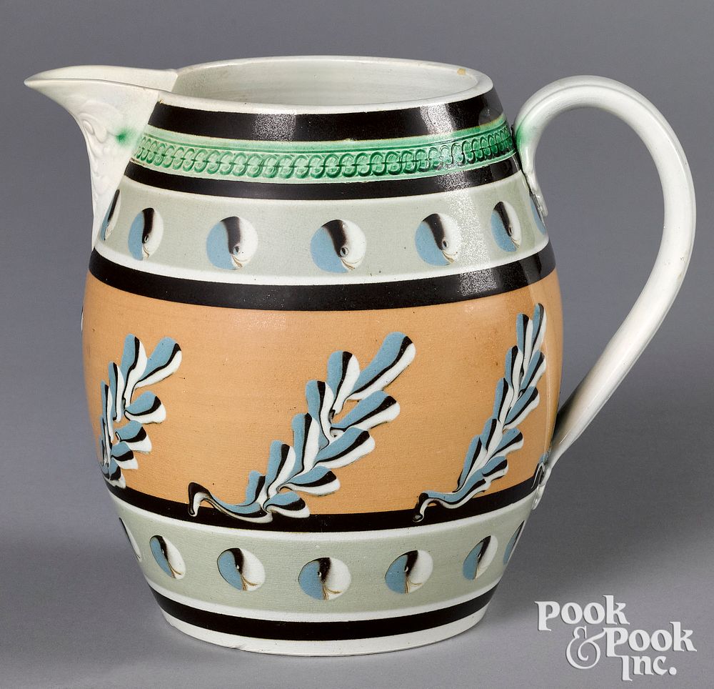 Appraisal: Mocha pitcher with cat's-eye and twig decoration Mocha pitcher with