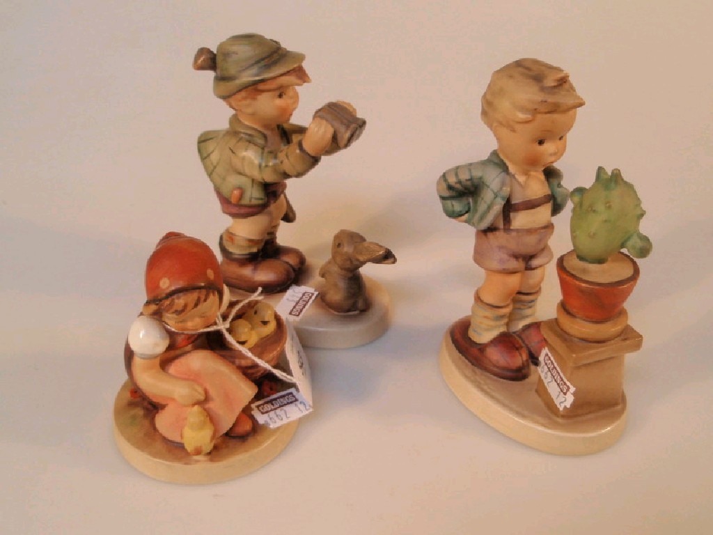 Appraisal: Goebel figures girl with chicks boy with cactus boy with