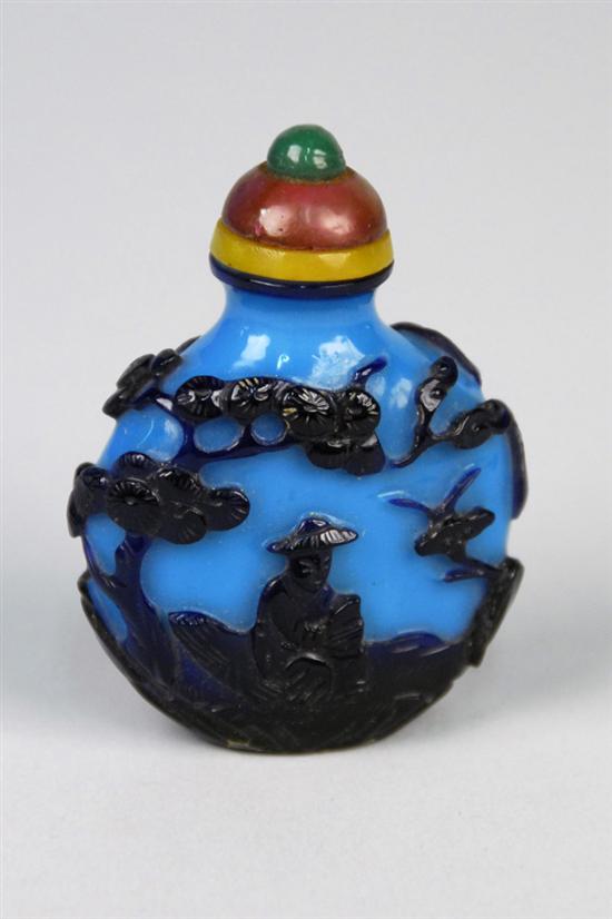 Appraisal: CHINESE CARVED BLUE GLASS OVERLAY SNUFF BOTTLE in a fitted