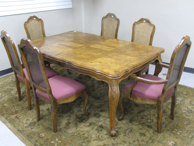 Appraisal: LOUIS XV STYLE OAK DINING TABLE AND CHAIR SET American