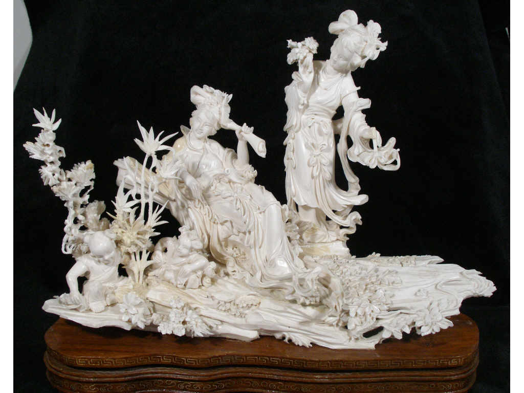 Appraisal: Carved Ivory Multi-Figural Garden Scene Oriental early th c intricate