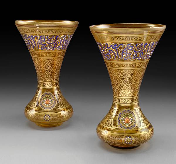 Appraisal: A pair of Lobmeyr style Persian inspired enameled amber tinted