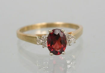 Appraisal: A Ladies' Dainty Garnet and Diamond Ring Yellow gold ring