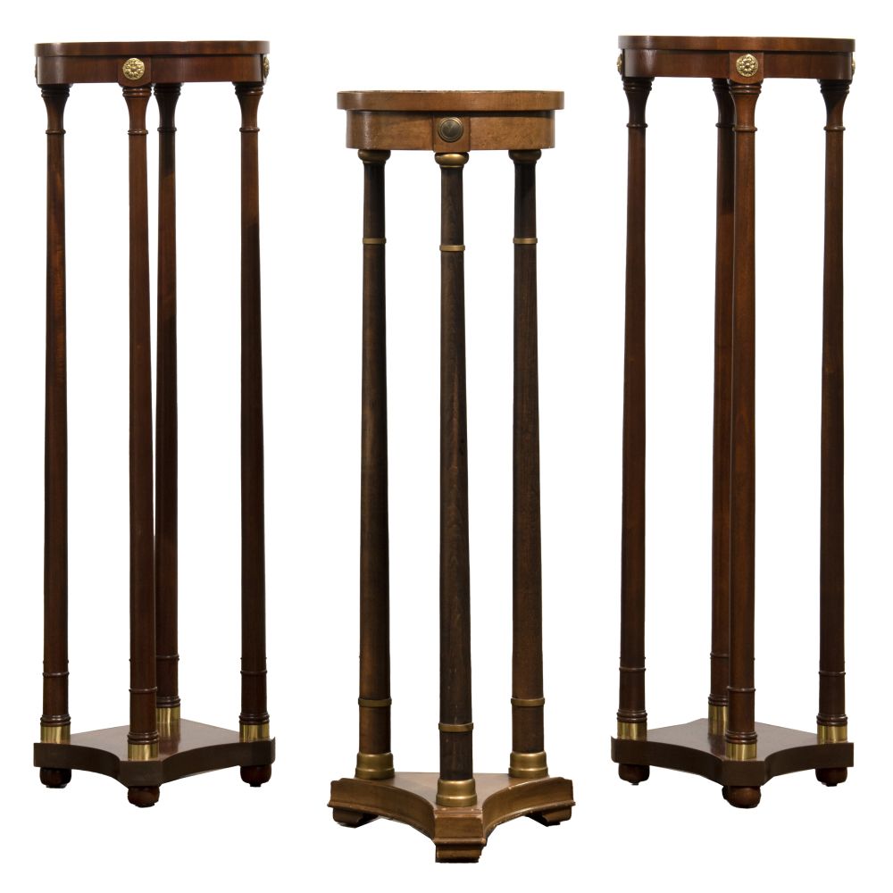 Appraisal: BAKER MAHOGANY PLANT STANDSMatching pair having round legs with brass