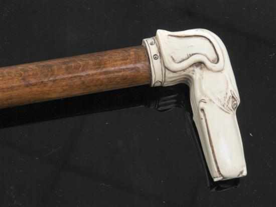 Appraisal: An ivorine hound head handled walking stick th century signed