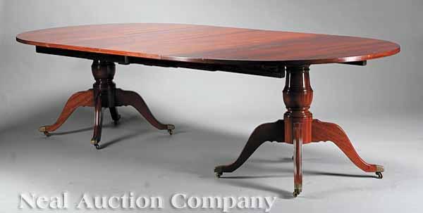 Appraisal: A Georgian-Style Mahogany Two Pedestal Dining Table the baluster supports