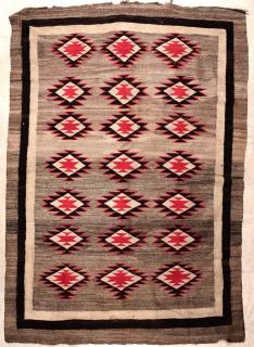 Appraisal: A LARGE NAVAJO RUG APPROXIMATELY X FEET The field with