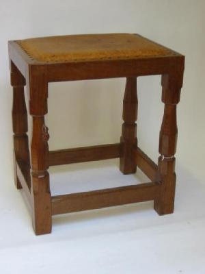 Appraisal: AN ADZED OAK STOOL by Robert Mouseman Thompson of oblong