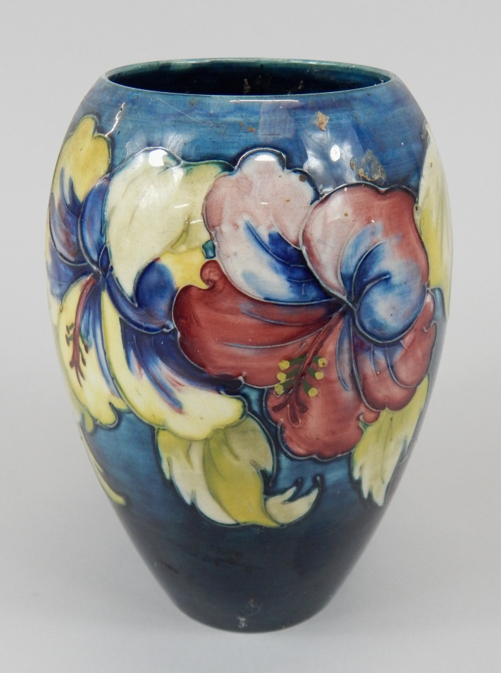 Appraisal: A Moorcroft bullet shaped vase decorated with a band of