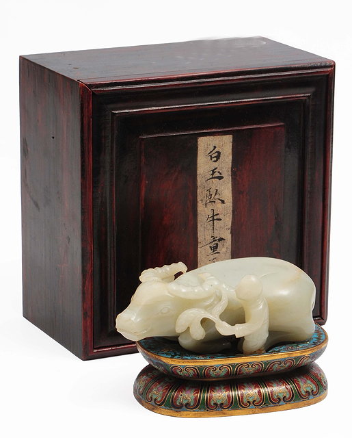 Appraisal: A Chinese white jade carving of a recumbent water buffalo