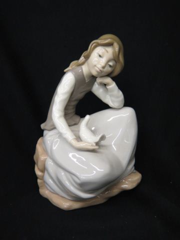 Appraisal: Nao Lladro Porcelain Figurine of Seated Girl with dove excellent