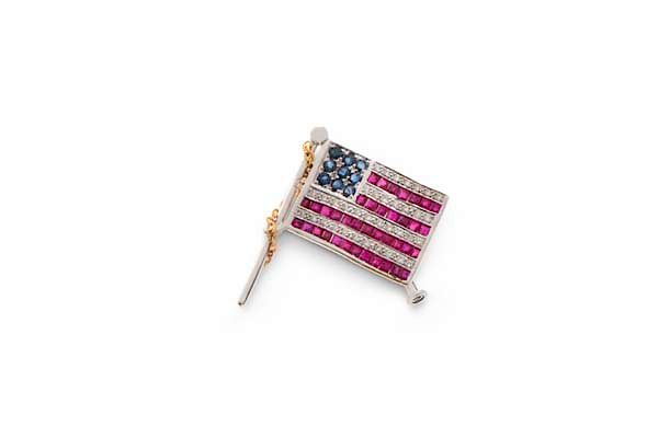 Appraisal: A ruby sapphire diamond K gold flag pin A ruby