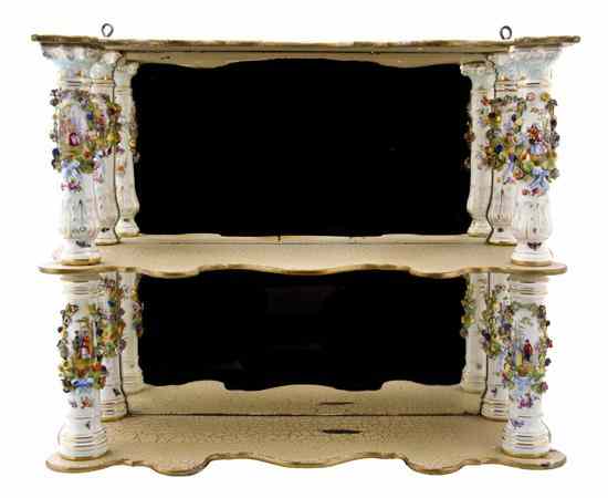 Appraisal: A Dresden Porcelain Hanging Wall Shelf with serpentine shelves and