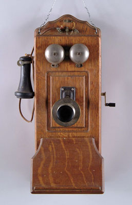 Appraisal: OAK WALL TELEPHONE Panel front adjustable mouthpiece foldaway bottom oak