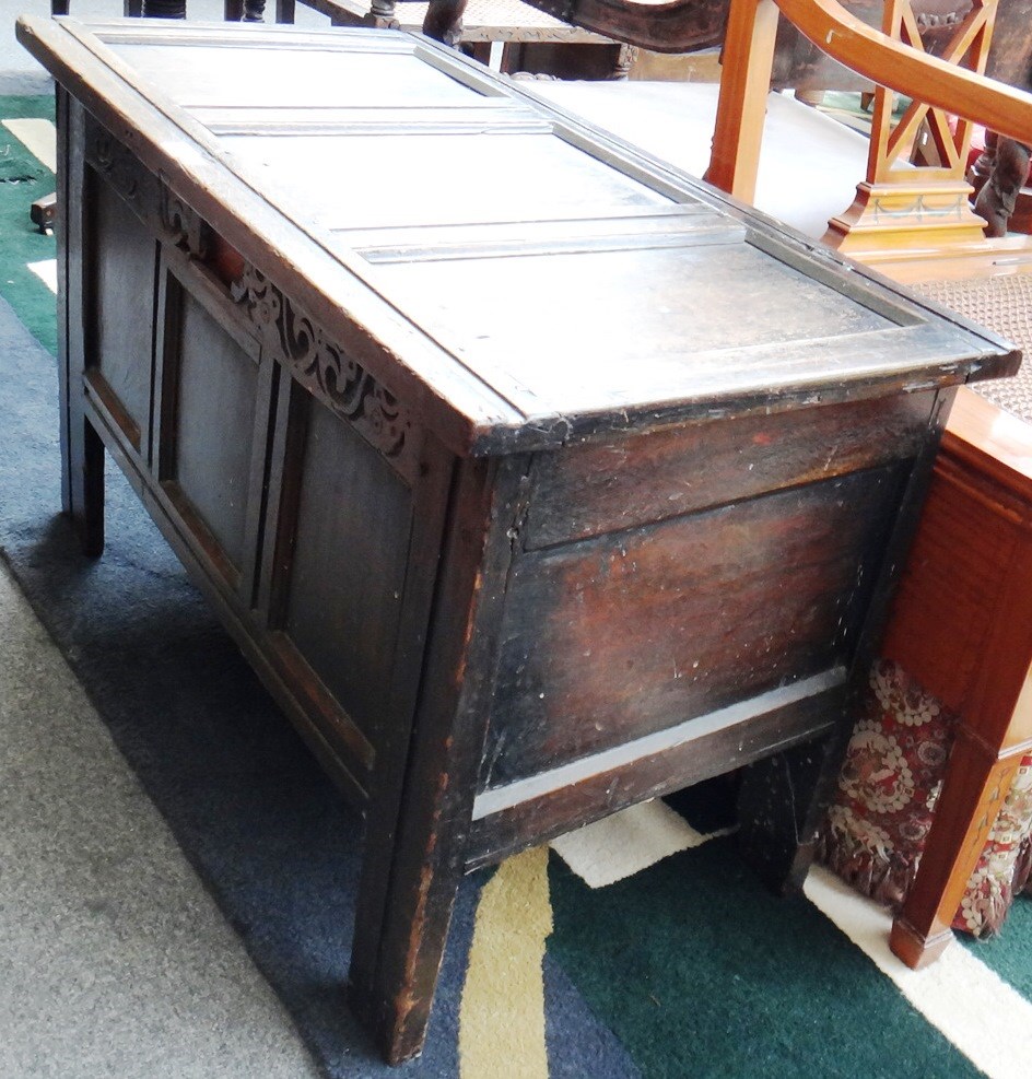 Appraisal: An early th century oak coffer with triple panel top