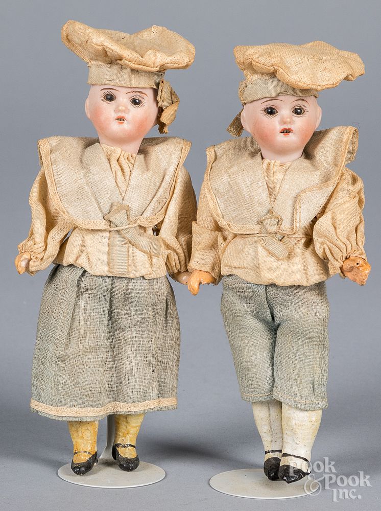 Appraisal: Twin boy and girl bisque head dolls Twin boy and