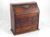 Appraisal: A miniature oak writing bureau with mahogany veneer and boxwood