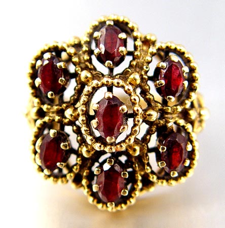 Appraisal: GOLD AND GARNET RING K GARNET RING K yellow gold