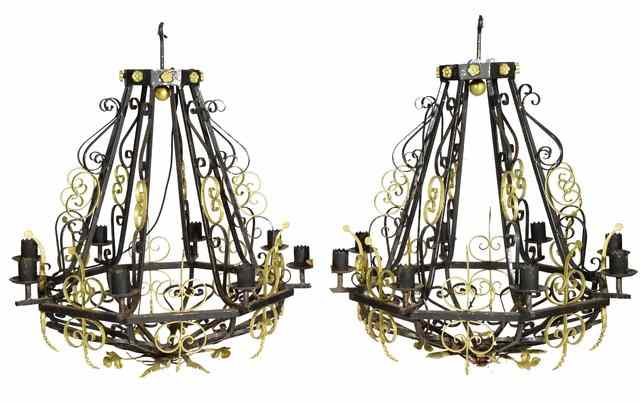 Appraisal: A PAIR OF WROUGHT IRON CHANDELIERS of open scroll form